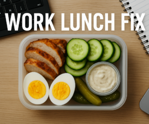 Overhead office desk scene with a substantial keto work lunch, keyboard nearby, and bold text Work Lunch Fix