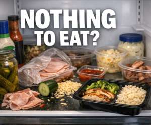 Open fridge with scattered keto ingredients and one clear ready-to-eat meal box beside bold text NOTHING TO EAT?